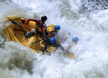 rafting team hitting the bottom of a falls